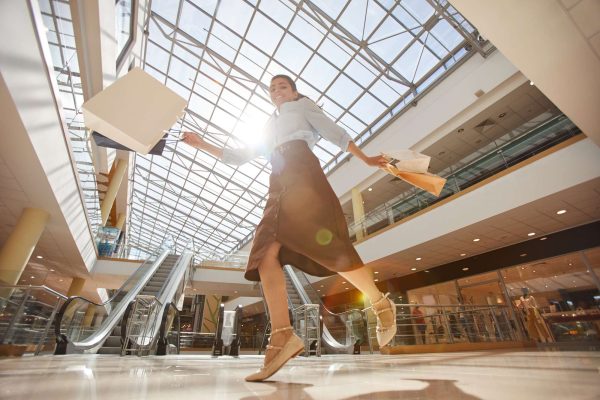Carefree Young Woman in Shopping Mall Carefree Young Woman in Shopping Mall