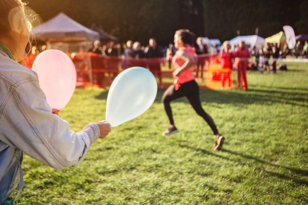 Supporter holding balloons at sports event Supporter holding balloons at sports event